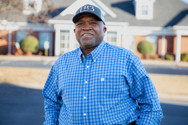 Dr. Wright's patient smiling outside of the office